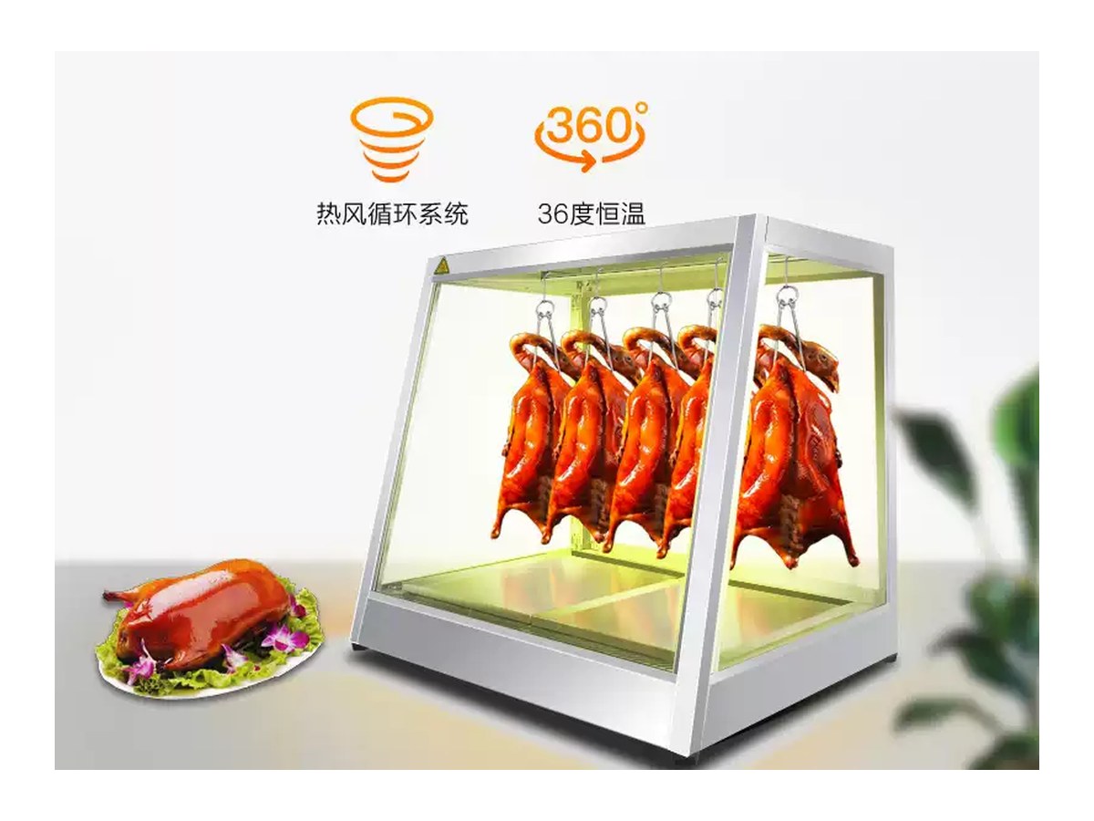 Heated glass display cabinet holding roast duck and suckling pig at serving temperature